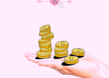 Hand mit Geldmünzen